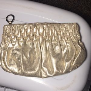 Scrunched Michael Kors gold going out clutch